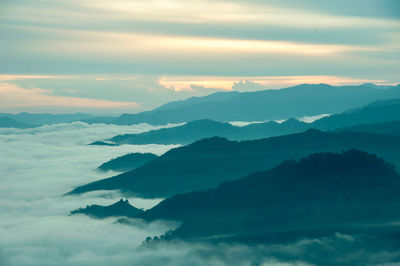 Aerial view of mountains against sky during sunset