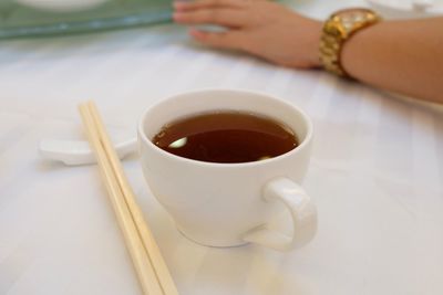 Close-up of coffee cup on table