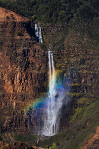 Low angle view of waterfall in hawaii