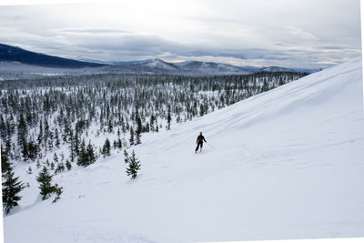 High angle view of man skiing on snowcapped mountain