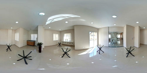 Empty chairs and table against wall at home