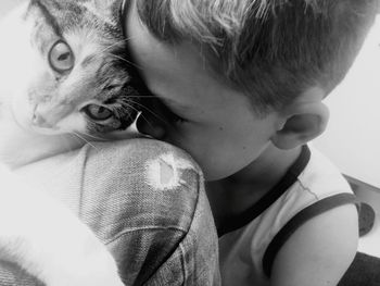 Close-up of boy with cat