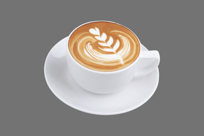 Coffee cup against black background