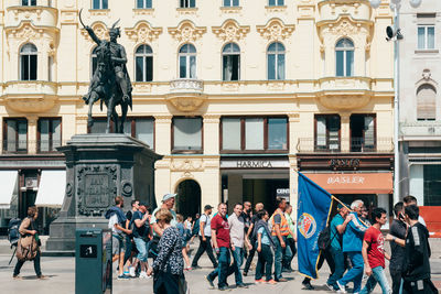 Group of people in front of building