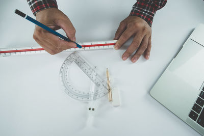 High angle view of man working on table