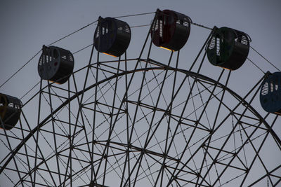 Low angle view of ferris wheel against sky