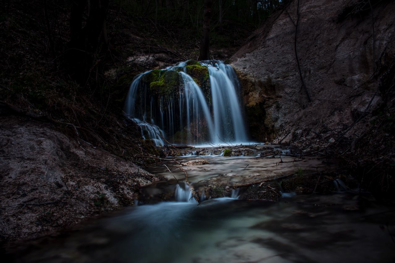 waterfall, long exposure, motion, water, blurred motion, travel destinations, social issues, rock - object, nature, no people, cave, beauty in nature, scenics, night, outdoors