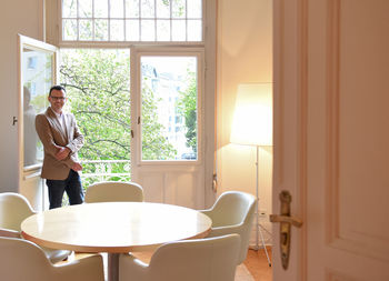 Young man smiling indoors