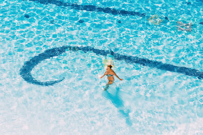 High angle view of swimming in pool