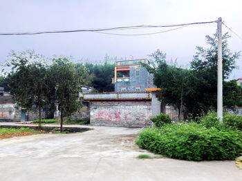 Built structure with trees in foreground