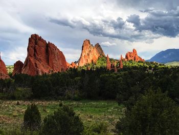 Rock formations on landscape against sky