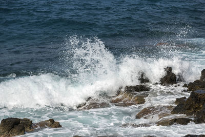 Waves splashing on rocks