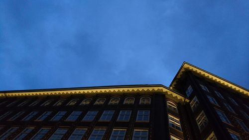 Low angle view of building against blue sky