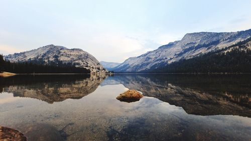 Scenic view of lake and mountains against sky