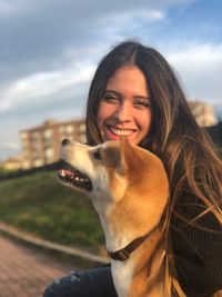 Portrait of a young woman with dog