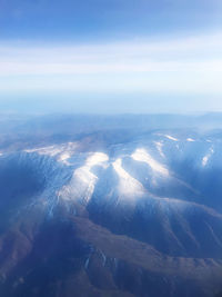 Aerial view of dramatic landscape against sky