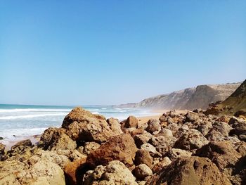 Scenic view of sea against clear blue sky