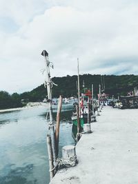 Boats in water against sky