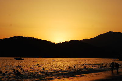 Scenic view of sea against orange sky