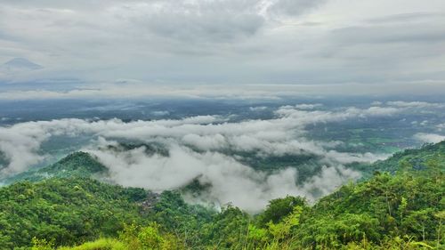 Beautiful views of hills and thick fog, against a background of white clouds