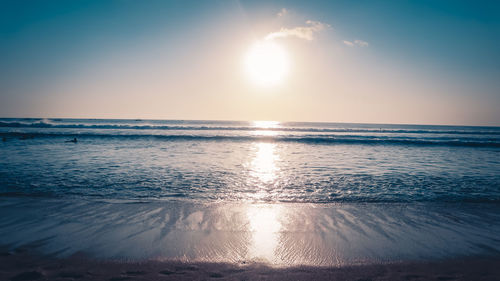 Scenic view of sea against sky at sunset