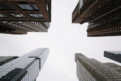 Low angle view of skyscrapers against clear sky