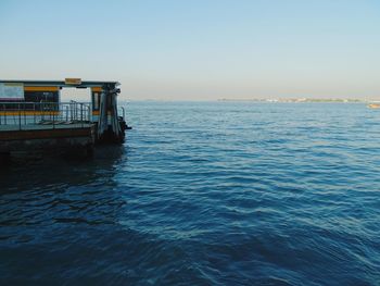 Scenic view of sea against clear blue sky