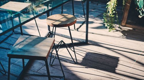 High angle view of empty chairs and table in restaurant