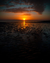 Scenic view of sea against romantic sky at sunset