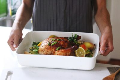 Midsection of man preparing food on table