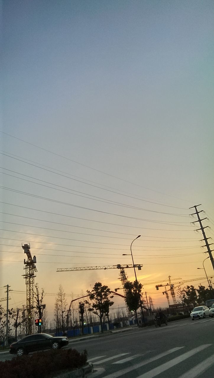 transportation, mode of transport, car, sunset, land vehicle, road, sky, clear sky, silhouette, copy space, street light, electricity pylon, street, power line, outdoors, nature, dusk, no people, road marking, connection