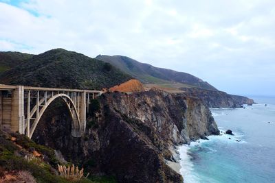 Scenic view of bridge over sea against sky