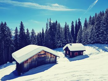 Snow covered built structure against sky