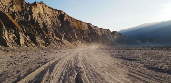 Panoramic view of road amidst mountains against sky