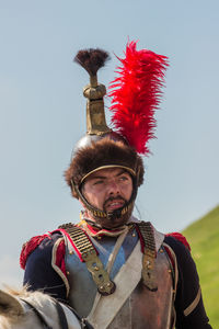 Portrait of man standing against sky