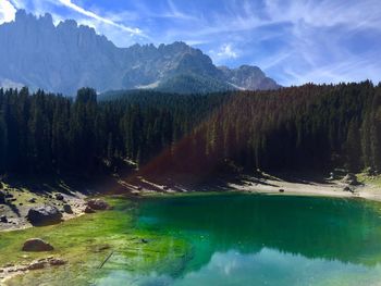 Scenic view of lake and mountains against sky