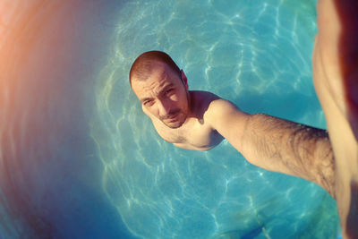 High angle view of man swimming in pool