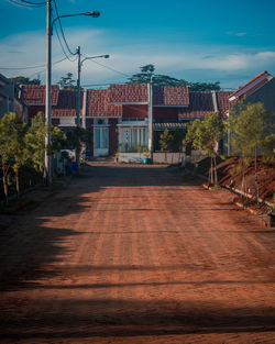 Footpath amidst buildings in town