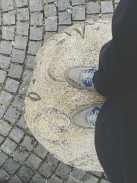 Full length of person walking on footpath