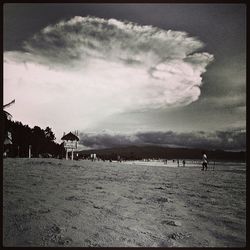 Scenic view of sea against cloudy sky