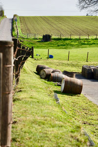 Scenic view of agricultural field seen through fence