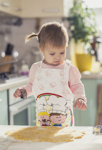 Portrait of cute girl sitting on table