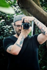 Close-up of man holding camera