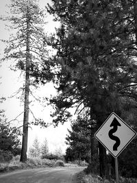 Close-up of road sign against clear sky