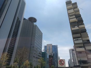 Low angle view of modern buildings against sky