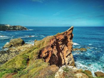 Scenic view of sea against clear blue sky