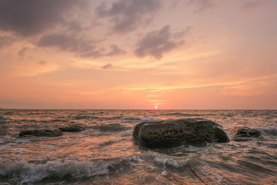 Scenic view of sea against sky during sunset