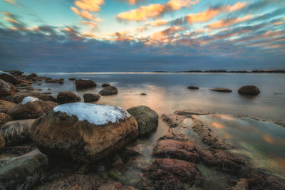 Scenic view of sea against sky during sunset