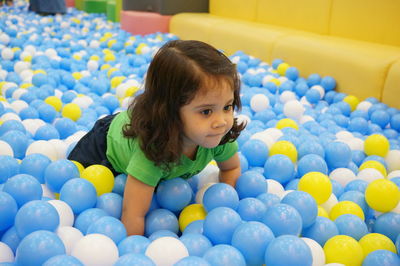 Portrait of cute girl with multi colored balls