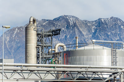 Factory against sky during winter